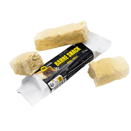 Barre Airbar Snack vanille enrobée de chocolat blanc avec plusieurs morceaux coupés laissant voir la texture céréalière croustillante à l’intérieur