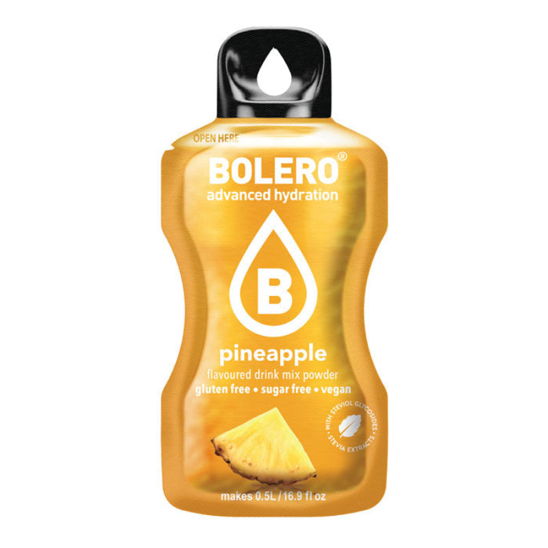 Sachet de boisson Bolero goût ananas sans sucre avec morceau d’ananas jaune juteux illustré en bas de l’emballage doré