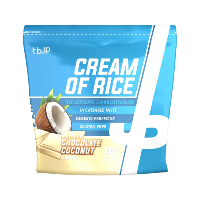 Sachet bleu de Cream of Rice TBJP saveur chocolat blanc et noix de coco avec éclats de chocolat blanc et demi-noix de coco en visuel