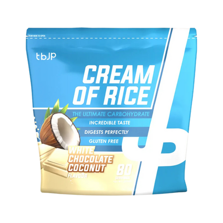 Sachet bleu de Cream of Rice TBJP saveur chocolat blanc et noix de coco avec éclats de chocolat blanc et demi-noix de coco en visuel