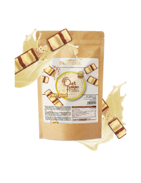 Sachet de flocons d’avoine IOGenix Delicious Oat Flakes saveur U’Praline entouré de carrés chocolatés fourrés praliné et d’éclaboussures de lait sur fond blanc
