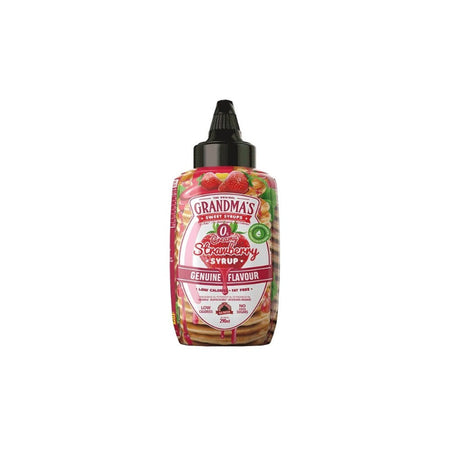 Bouteille de sirop Grandmas saveur fraise 0 calorie avec fraises et pancakes en arrière-plan sur fond blanc